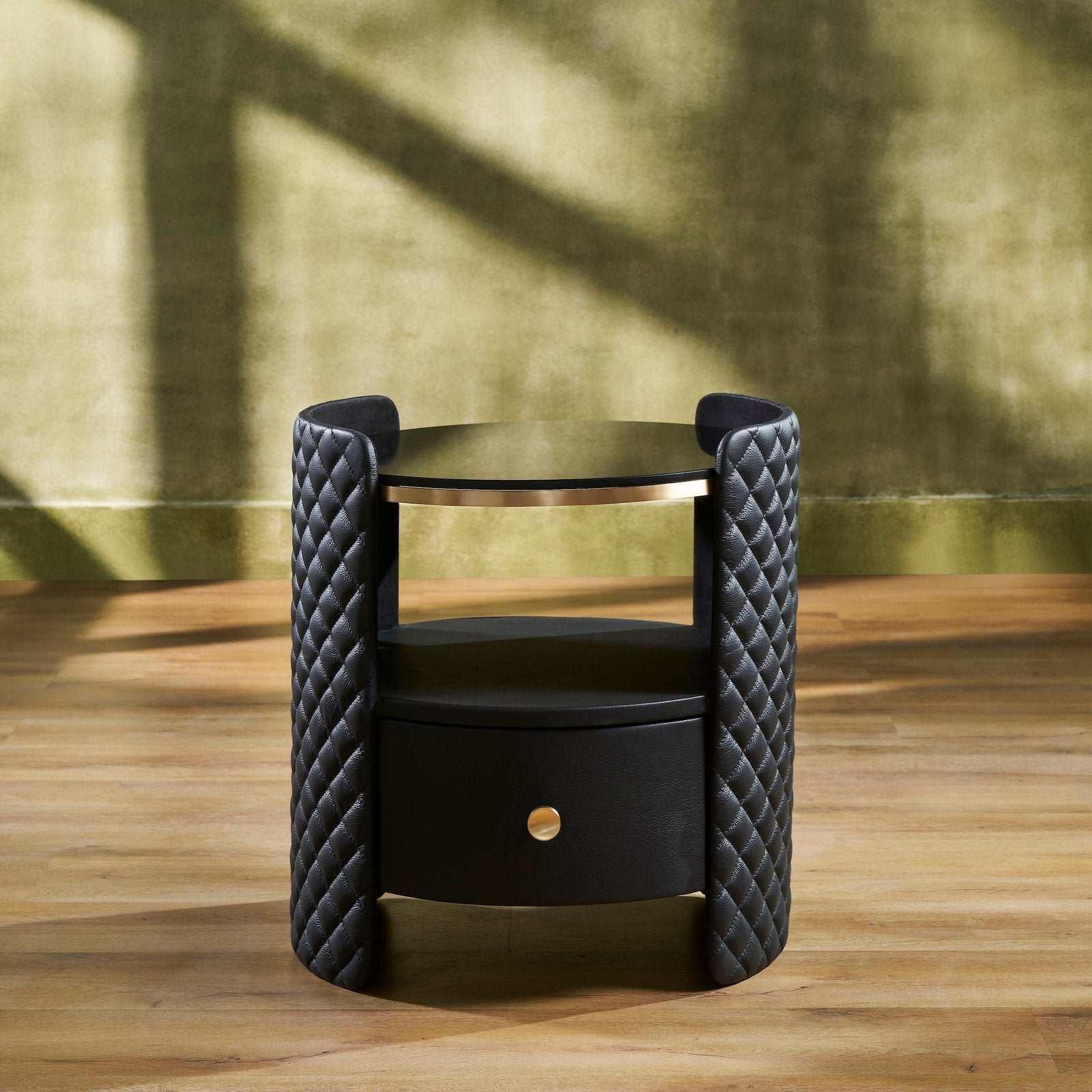 FN-5214-X_1|Luxurious black quilted nightstand with a sleek glass top and an elegant gold drawer pull, enhancing any modern bedroom decor.
