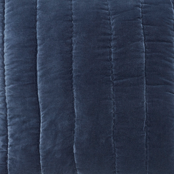 SS-335-2026_2|Deep navy blue velvet quilt with vertical channel stitching. Plush, luxurious bedding for warmth and comfort, adding elegance to any bedroom.