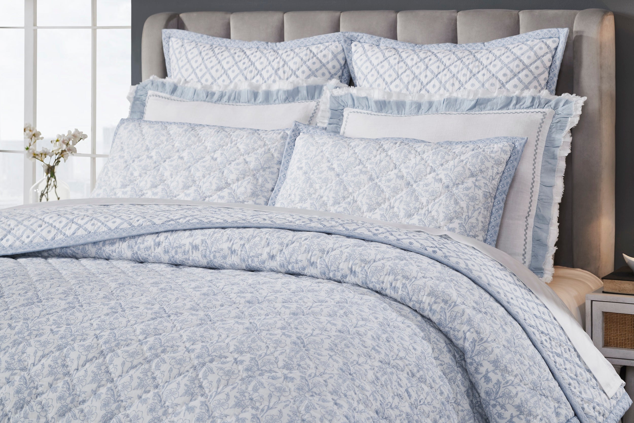 QT-345-11096_3|Close-up of light blue floral patterned quilt with diamond stitching, ideal for a serene bedroom decor.