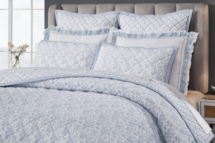 QT-345-11096_3|Close-up of light blue floral patterned quilt with diamond stitching, ideal for a serene bedroom decor.