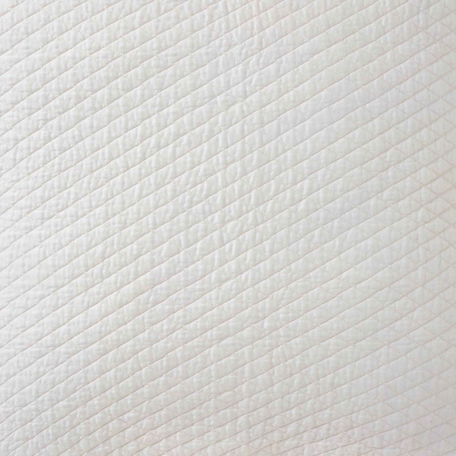 SWT-264-X_1|White quilted fabric swatch with elegant diagonal stitching and soft texture. Ideal for bedding and upholstery.