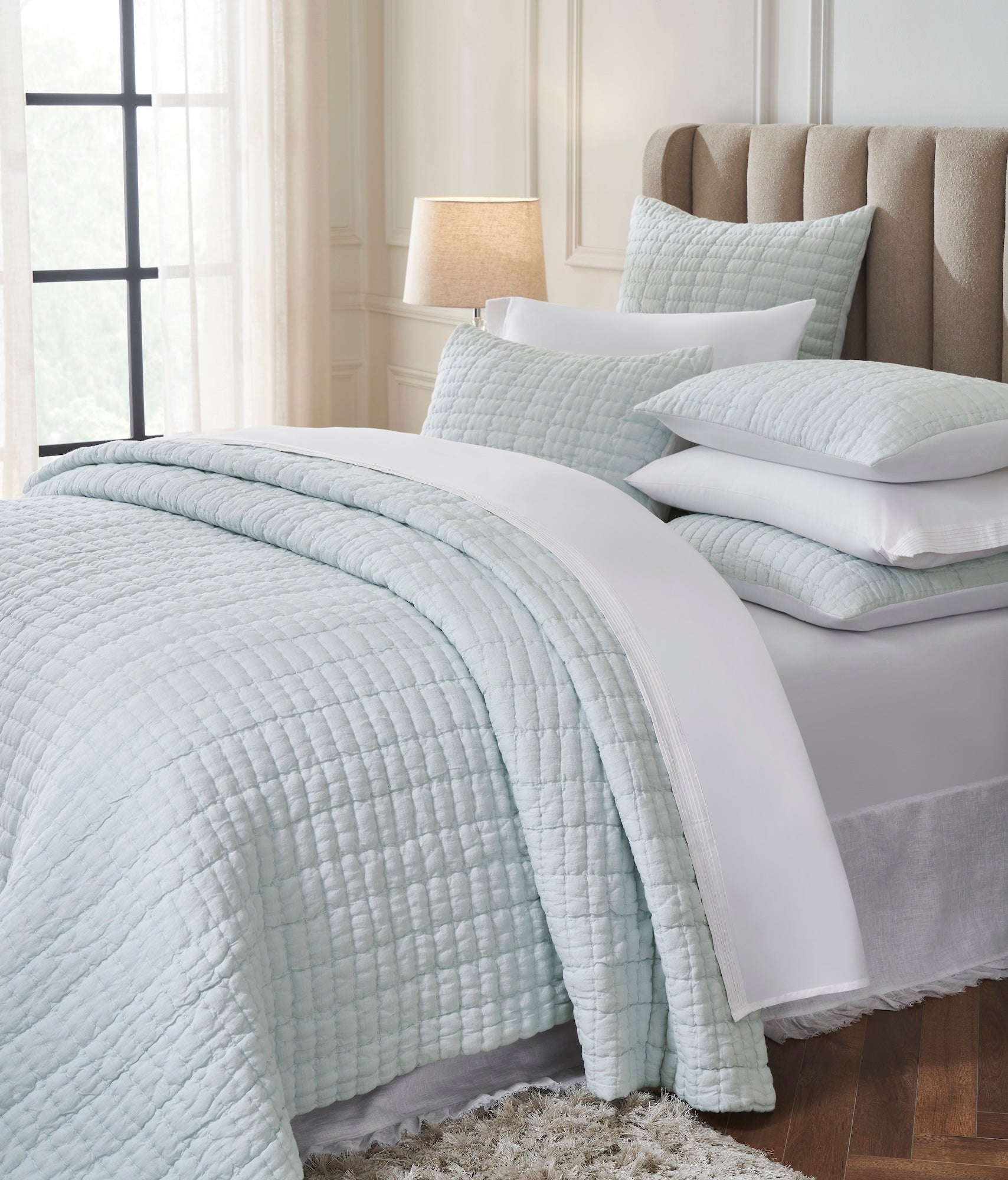 QT-373-11096_3|Close-up of soft light blue textured quilt and pillows, highlighting the elegant bedding for a serene and comfortable bedroom.