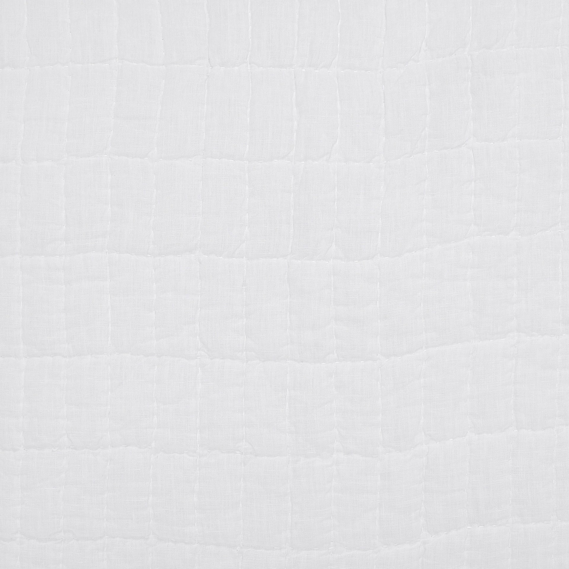 SWT-372-7.8_1|Bright white textured fabric with a distinct quilted square grid pattern, enhancing comfort in home furnishings.