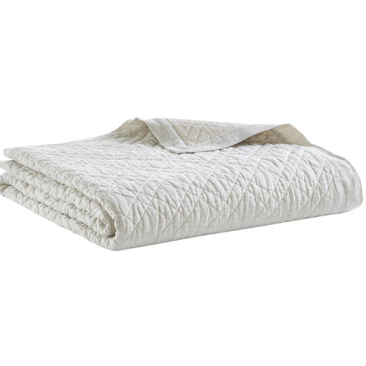 CL-254-9496_5|Soft beige linen-blend quilted coverlet, neatly folded. Ideal neutral bedding for added bedroom comfort and style.