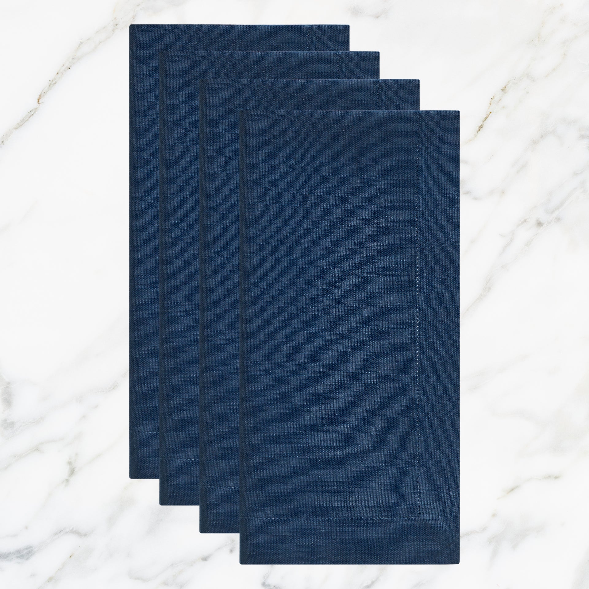 NP-4801-2020_1|Set of four folded navy blue linen-feel cloth dinner napkins, durable and elegant for dining, parties, or everyday use.