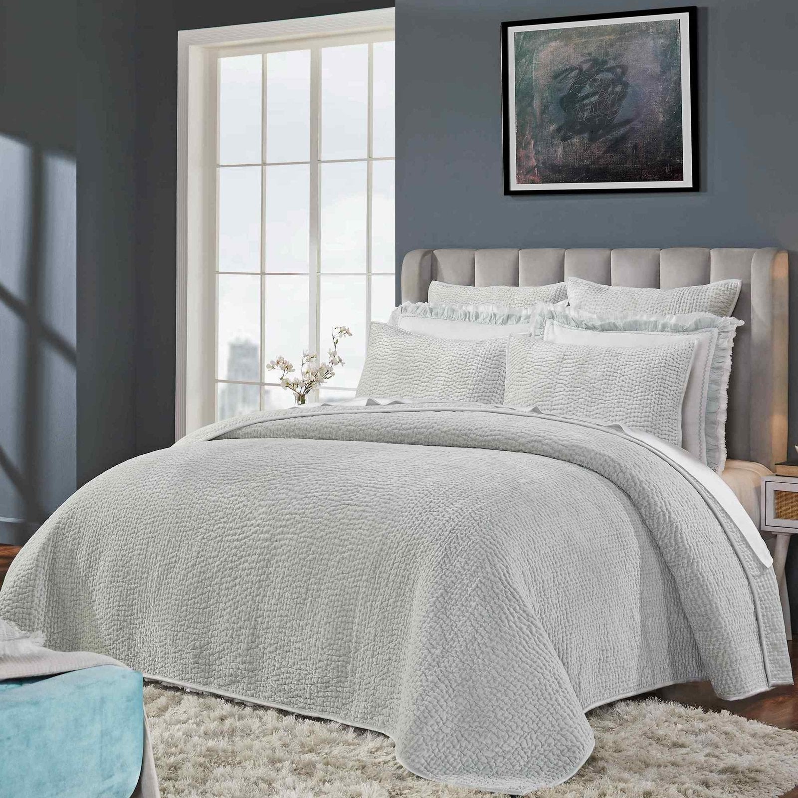 CL-183-9496_1|Elegant light gray textured coverlet adorning a modern bedroom bed, offering comfort and style. Perfect for restful sleep.