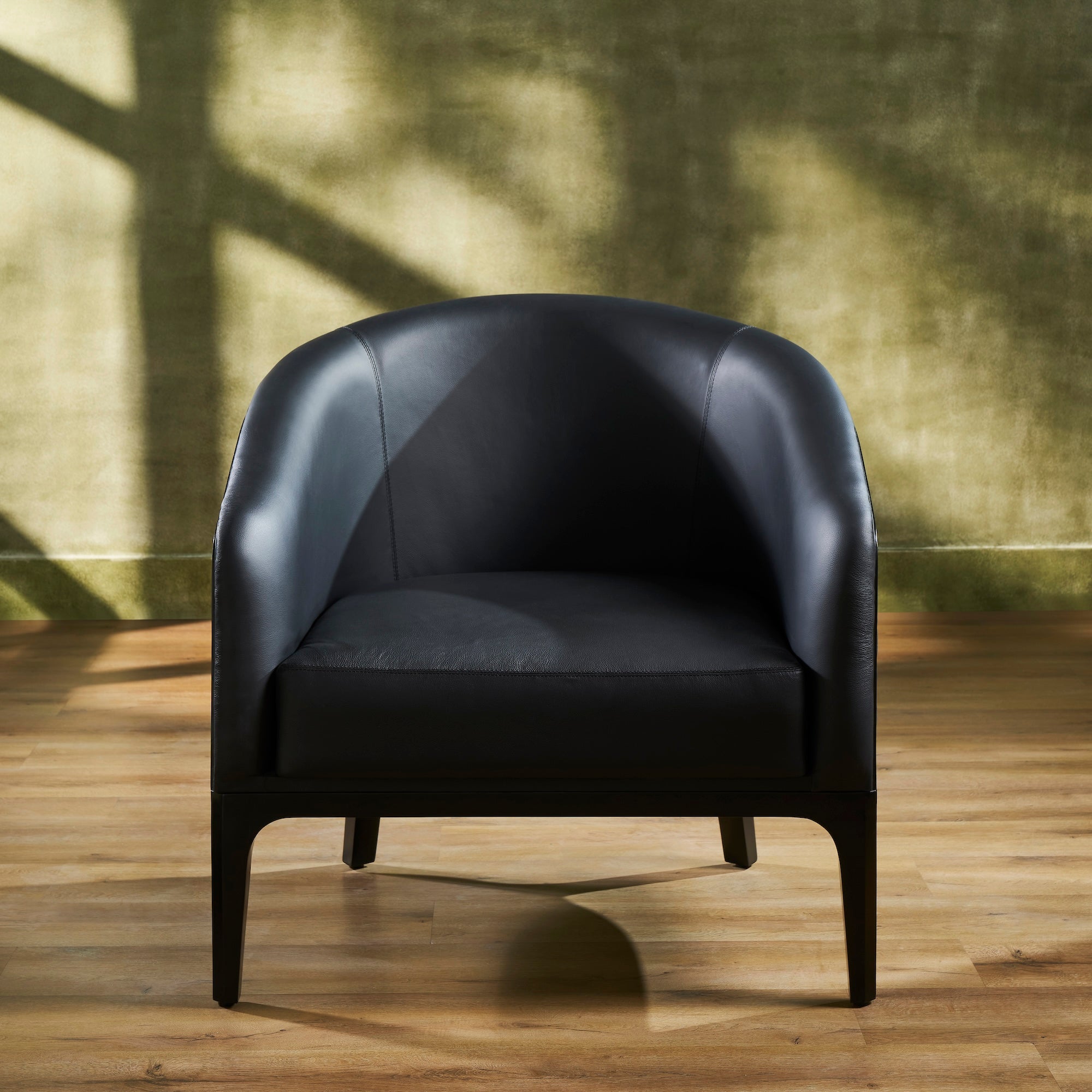 FN-5205-343329_4|Elegant black leather club chair with smooth upholstery and sturdy dark wooden legs, ideal for contemporary home office or lounge.