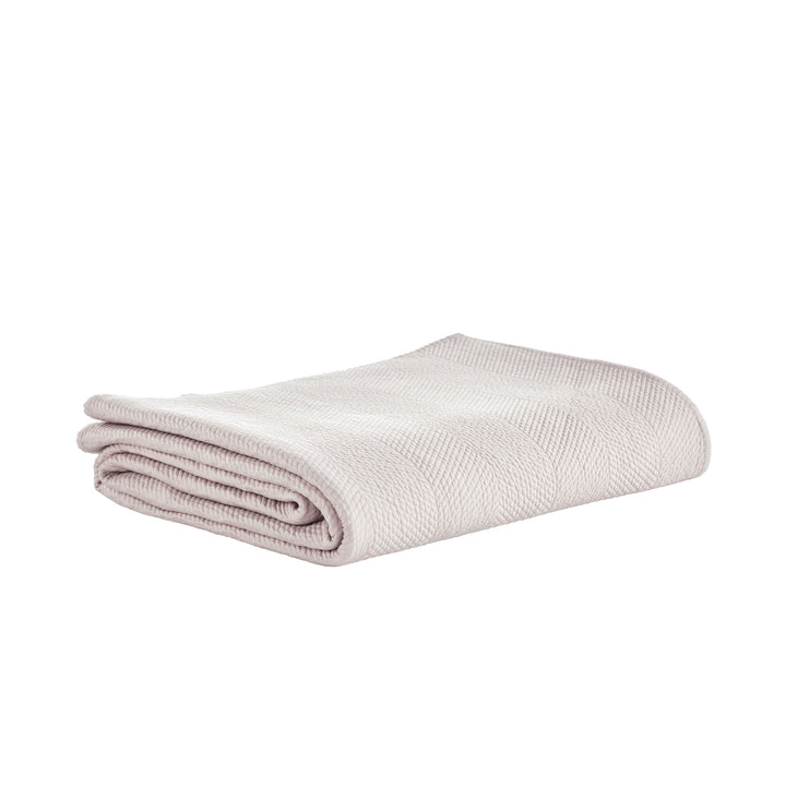 CL-171-9496_5|Neatly folded light beige quilted coverlet featuring a subtle herringbone pattern, perfect for luxurious neutral bedding.