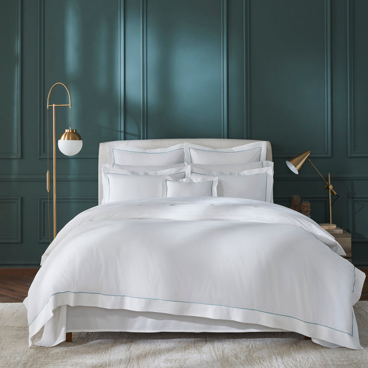 DT-055-6886_1|Luxurious white duvet cover with subtle light blue piping, enhancing a modern bedroom aesthetic. Soft, crisp bedding.