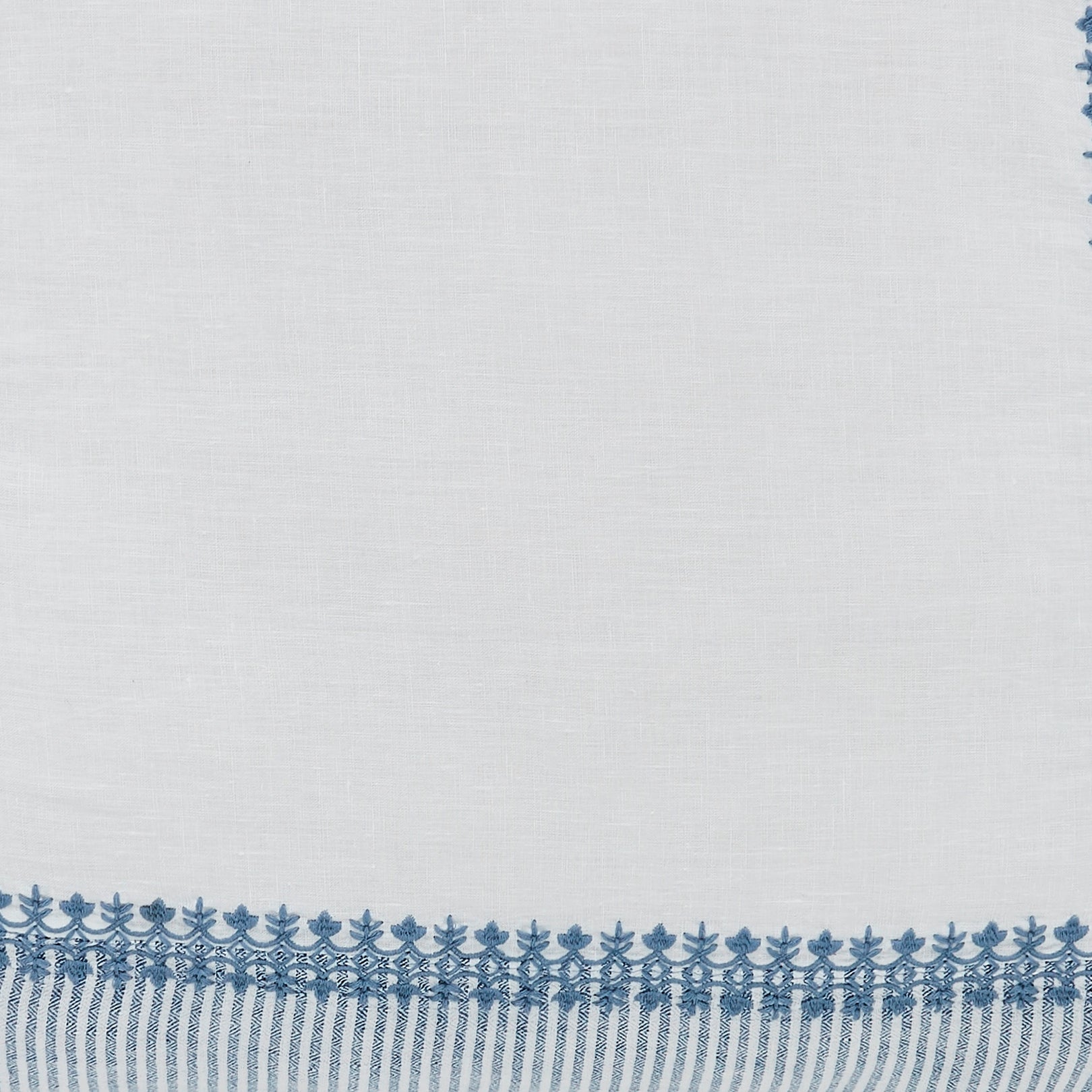 SWT-030-X_1|White linen blend fabric with intricate blue embroidered border, perfect for elegant tablecloths or decorative runners.