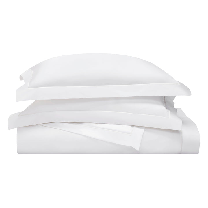 DT-065-10692_5|Stacked white luxury duvet cover and pillow shams, neatly folded, showcasing premium crisp cotton bedding essentials.