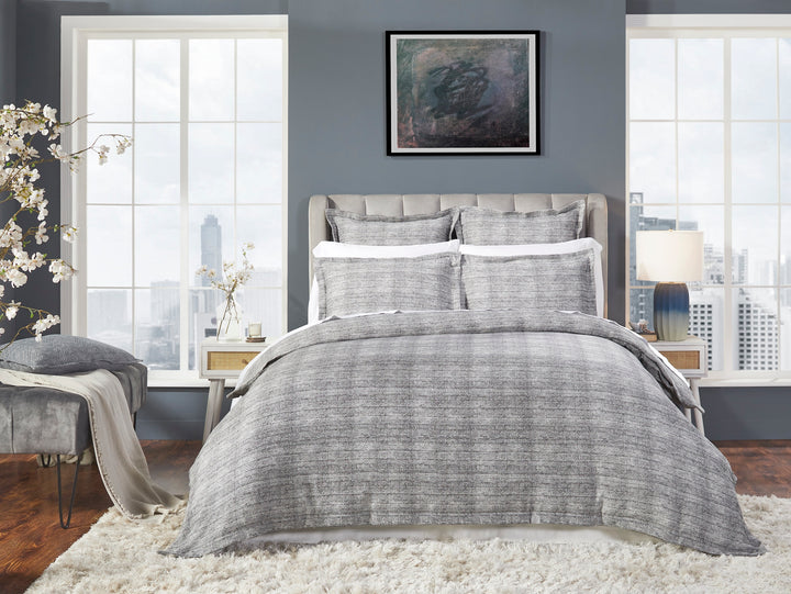 DT-034-9092_1|Sophisticated gray textured duvet cover set on a modern bed, enhancing a chic urban bedroom with large windows.