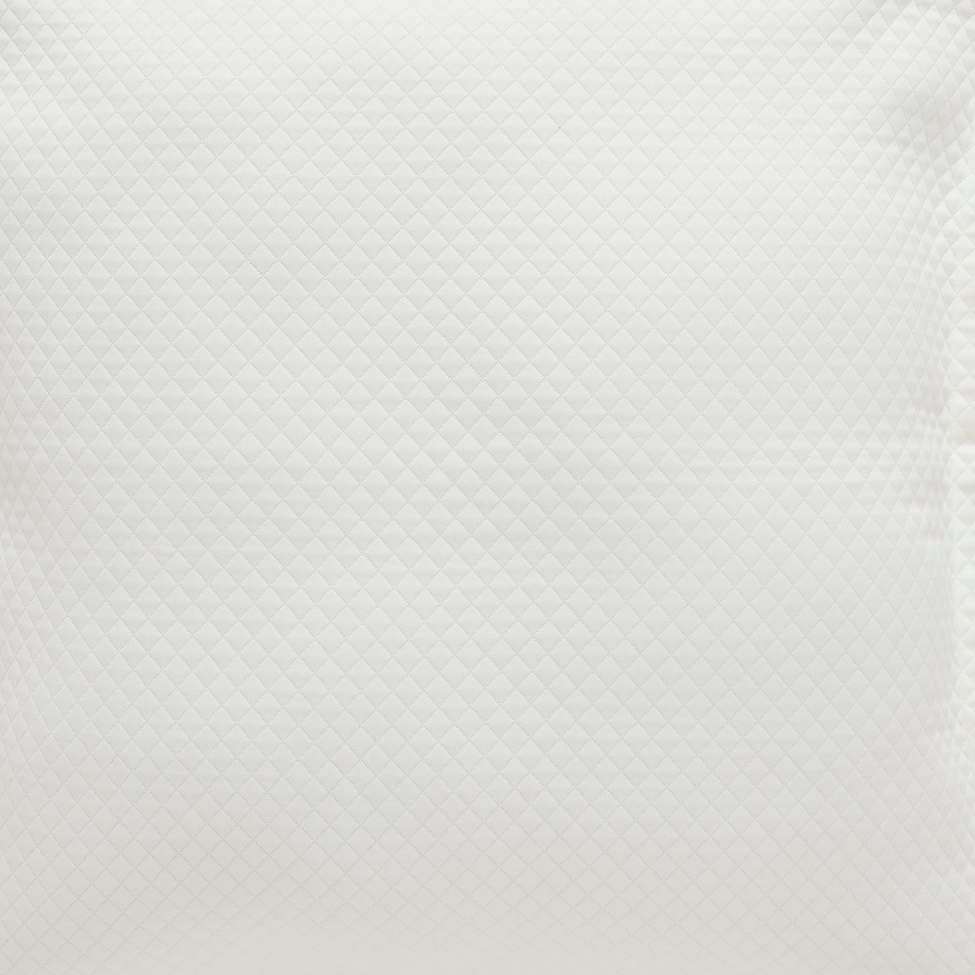 ES-189-2626-LOT1_2|Close-up of a white coverlet displaying a finely stitched diamond quilted pattern, adding sophisticated texture to bedding.