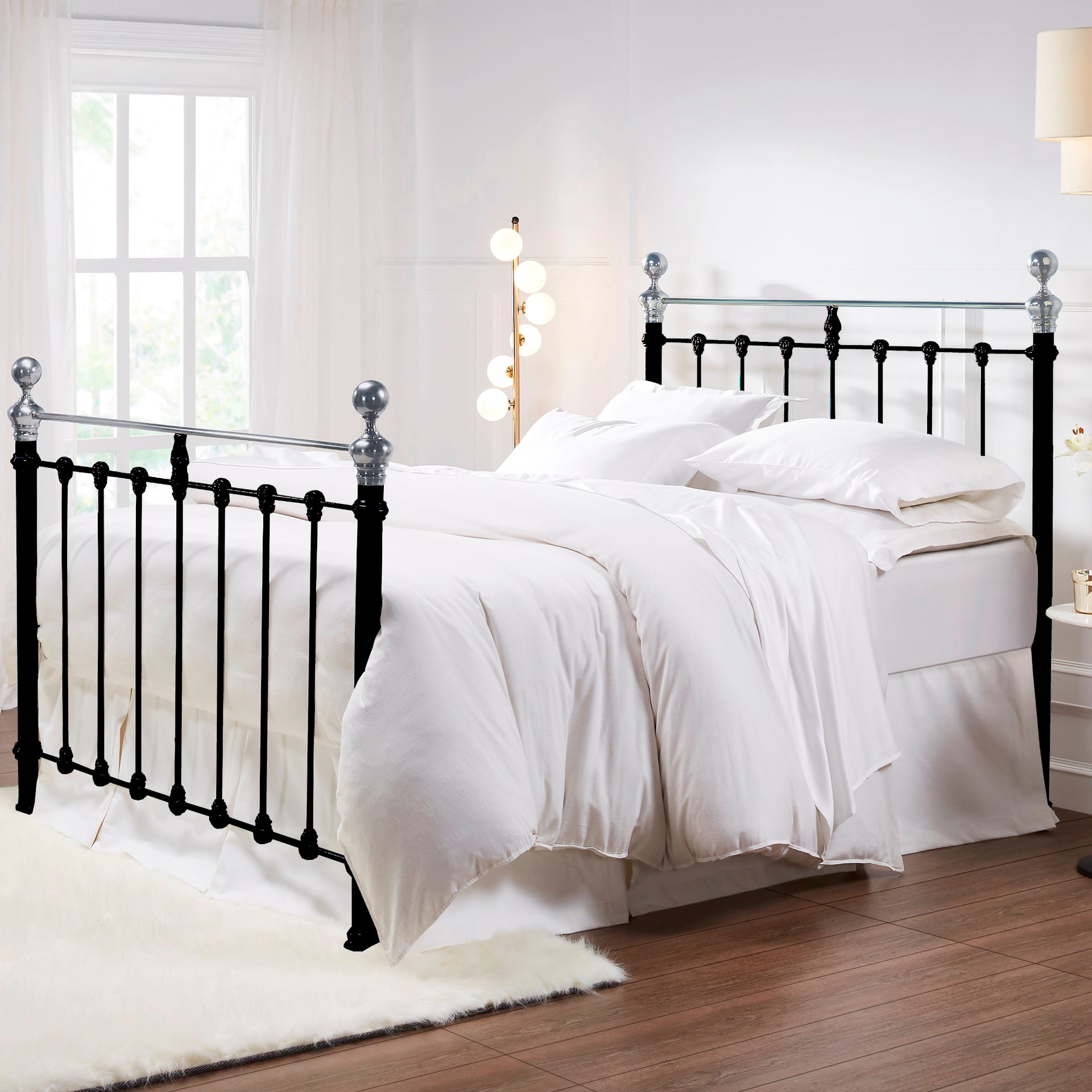 MB-211-6080_1|Stylish black metal bed frame with polished silver accents and luxurious white bedding for a contemporary bedroom.