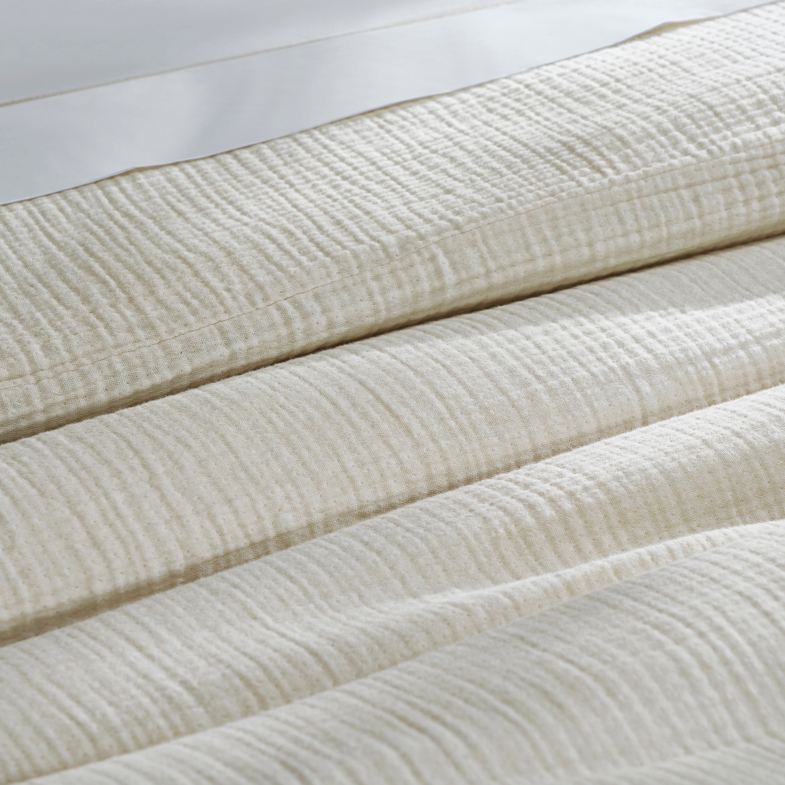 DT-049-9092_7|Close-up of elegant cream textured duvet cover fabric, highlighting its soft, breathable quality for cozy bedding.