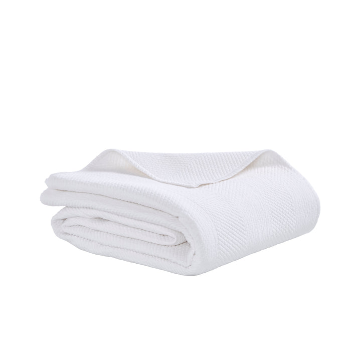 CL-170-11096_8|Pristine white chevron textured coverlet neatly folded, providing a clean, elegant, and modern bedding solution.