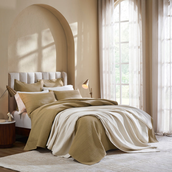 BL-860-9496_3|Gold waffle weave blanket paired with a soft cream throw, creating a cozy and luxurious modern bedroom setting.