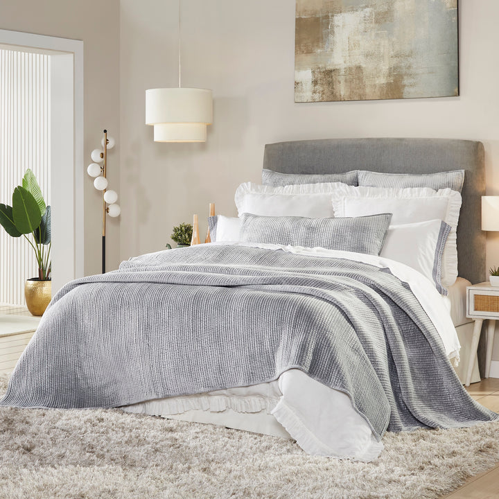 CL-169-11898_2|Stylish grey ribbed coverlet elegantly layered on a queen bed, offering a sophisticated and warm touch to a contemporary bedroom.