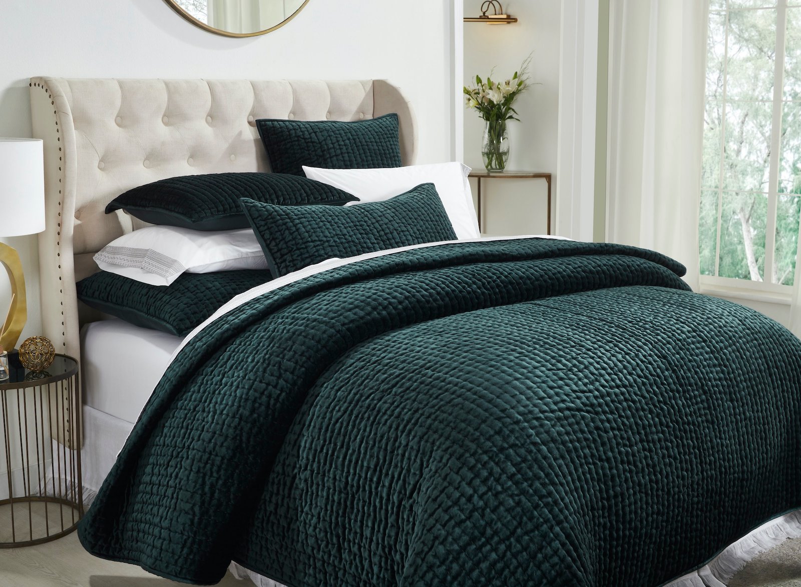 QT-363-9496_3|Lush dark green velvet quilted bedspread and pillows on a bed, creating a sophisticated and comfortable bedroom retreat.