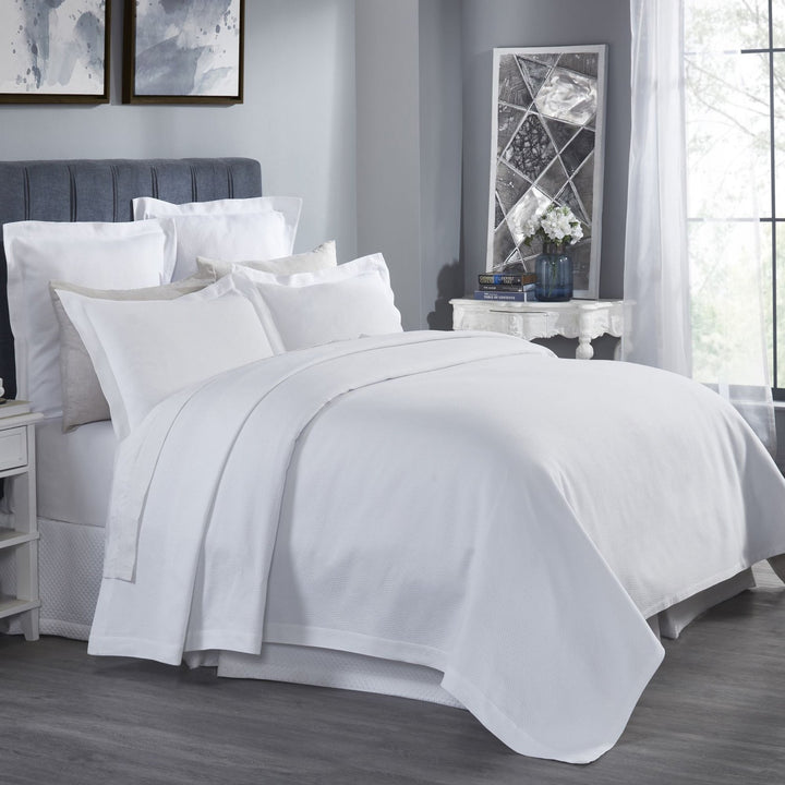 CL-258-11096_2|Crisp white coverlet featuring a delicate, subtle dimpled texture for a modern and clean bedroom design.
