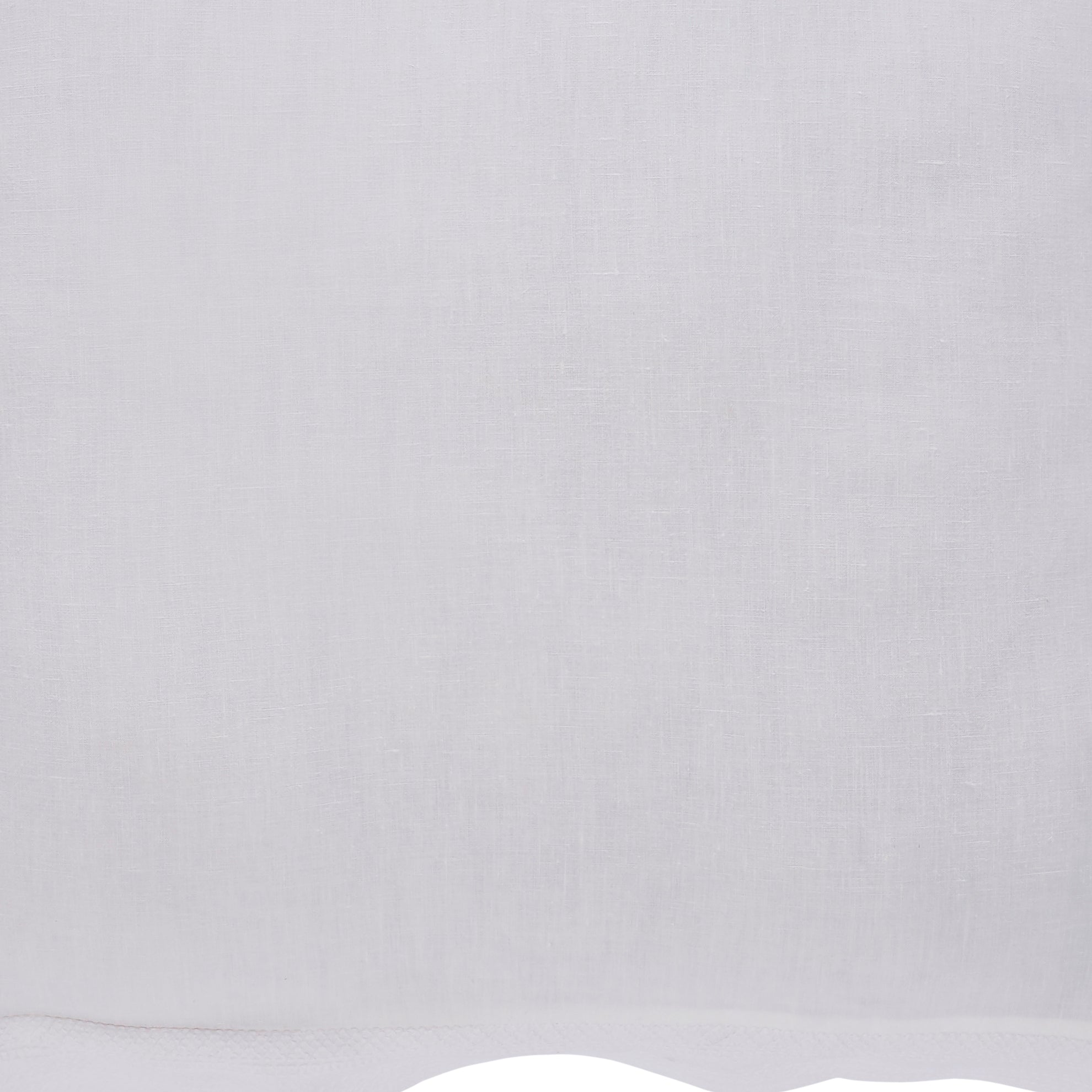 SWT-015-7.8_1|Pure white linen-look fabric with a finely textured weave. Clean and simple, showing a gently curved bottom border detail.