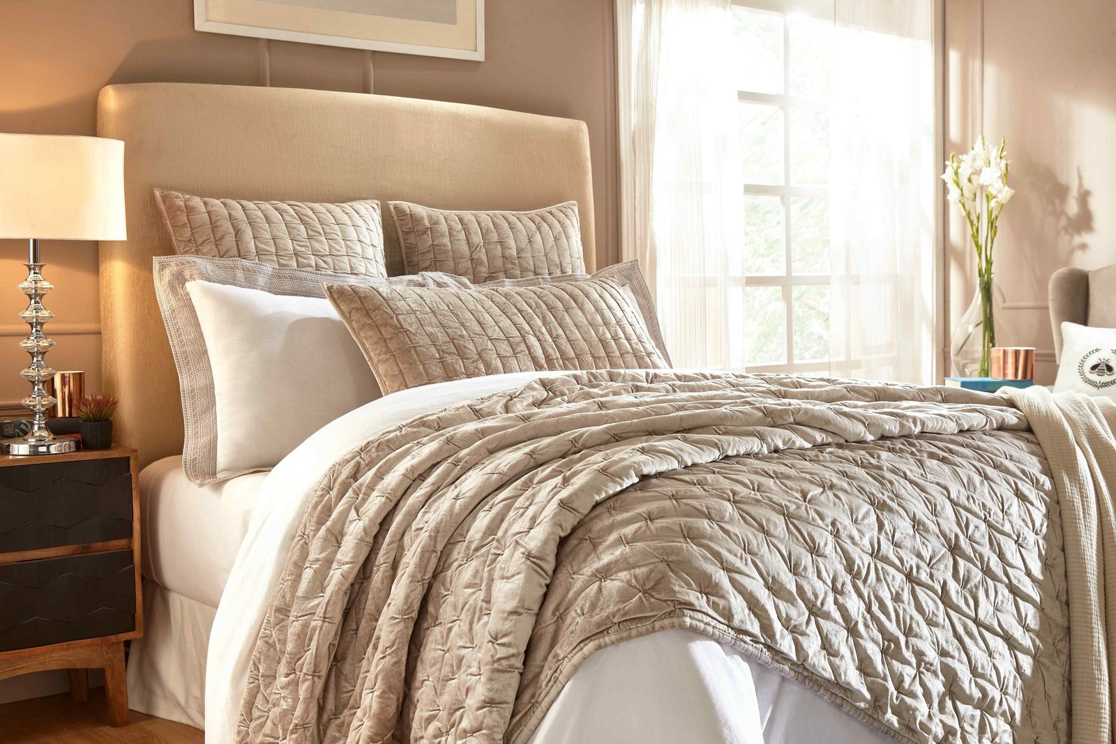 QT-312-9496_2|Elegant tan velvet pleated quilt draped luxuriously on a bed. Creates a warm, inviting atmosphere and stylish comfort.