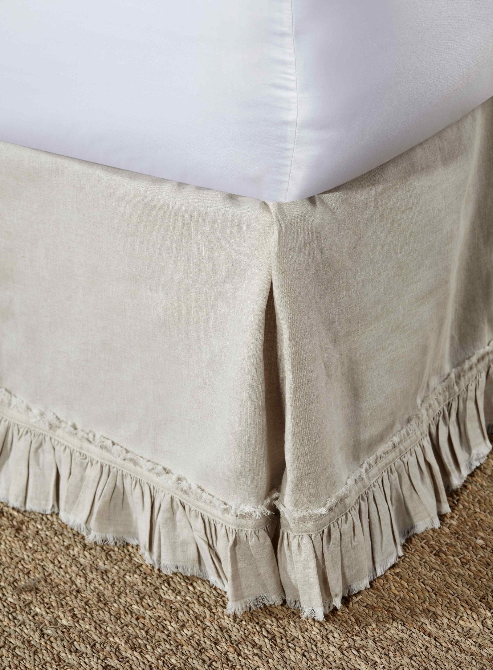 BS-104-7880_1|Elegant beige linen panel bed skirt featuring stylish ruffled and frayed edges, perfect for a rustic and chic bedroom aesthetic.