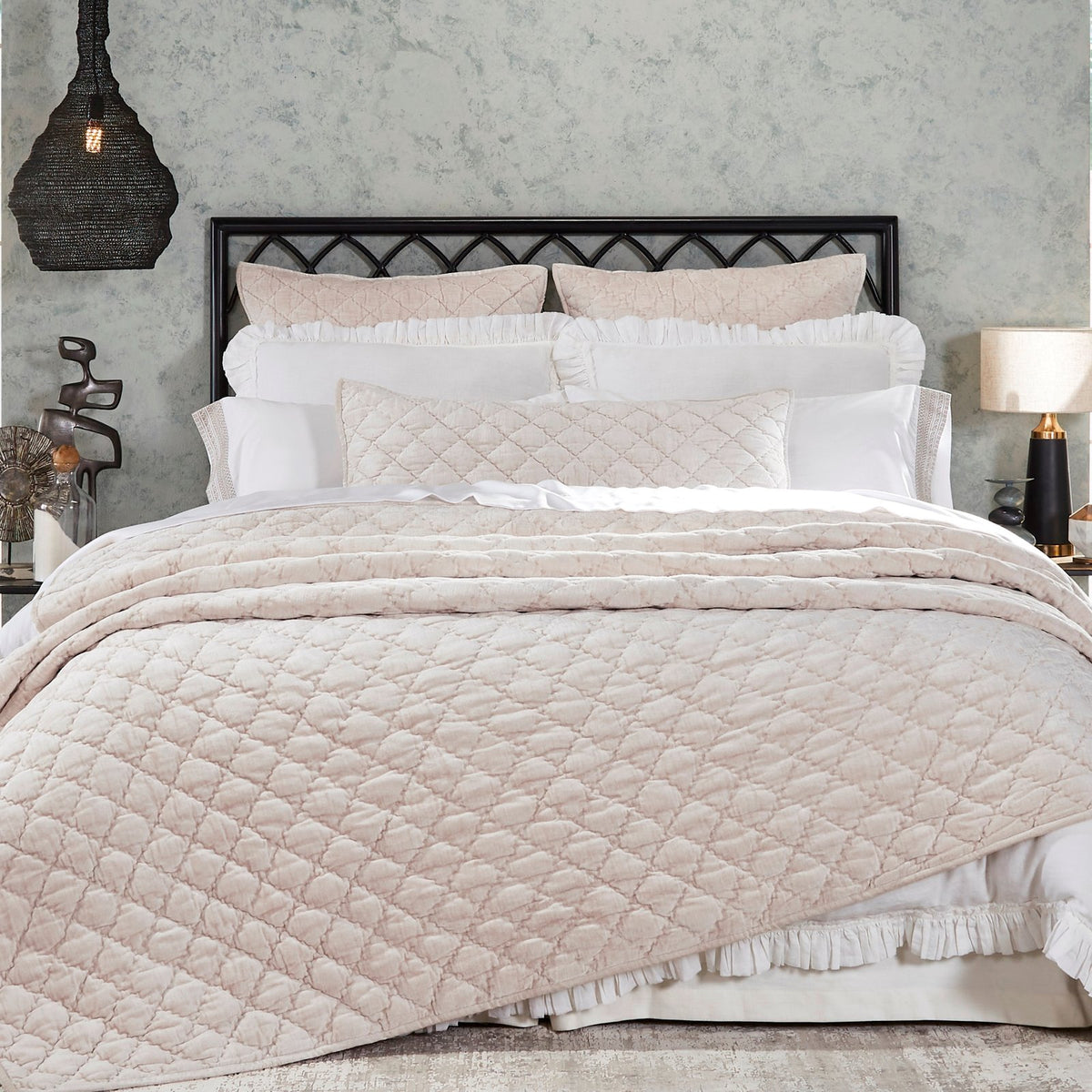 QT-342-11096_1|Luxurious blush pink quilt featuring a delicate diamond stitch, draped elegantly over a queen bed in a stylish bedroom.