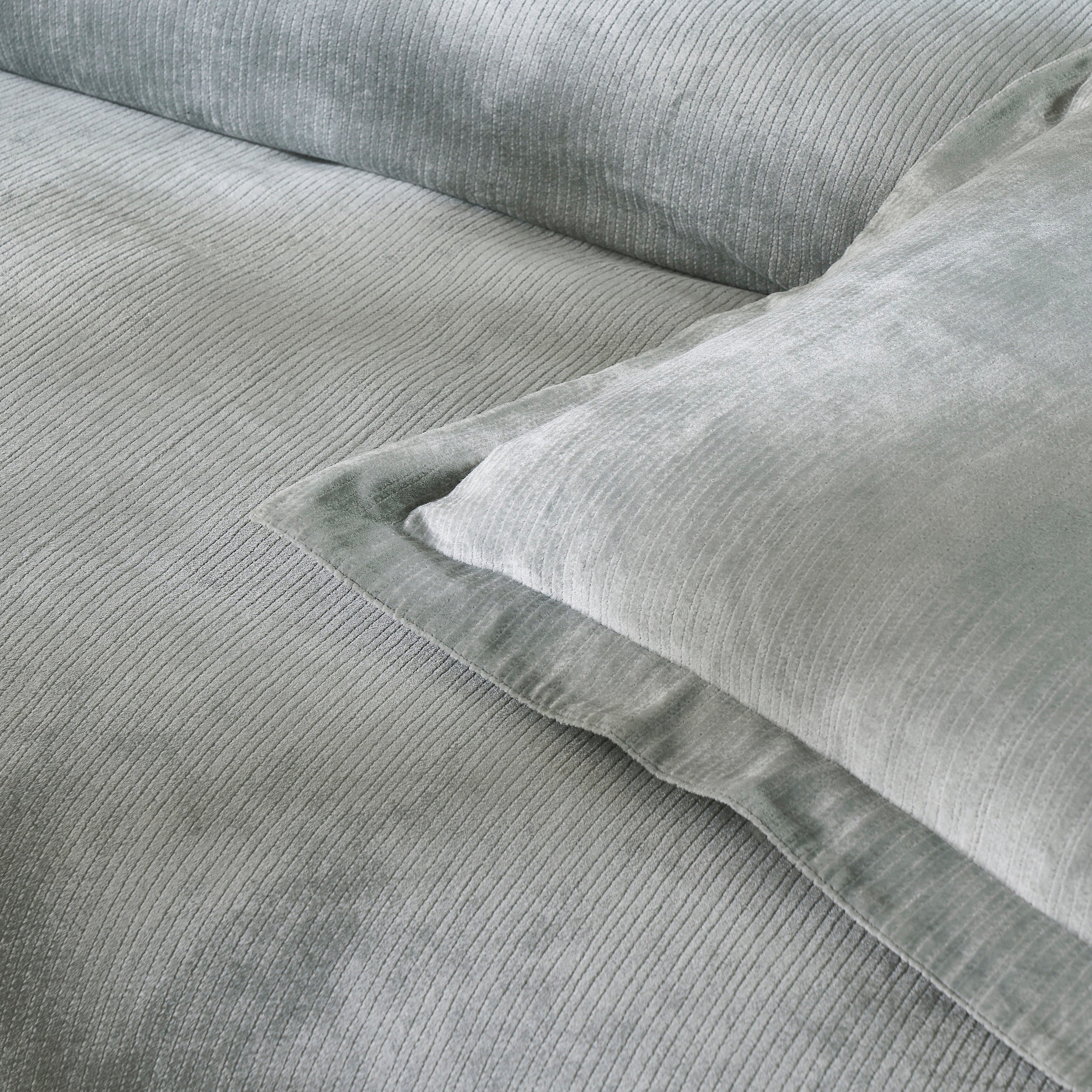 DT-054-9092_5|Close-up of a luxurious light grey velvet corduroy textured duvet cover and matching pillow sham, enhancing bedroom decor.