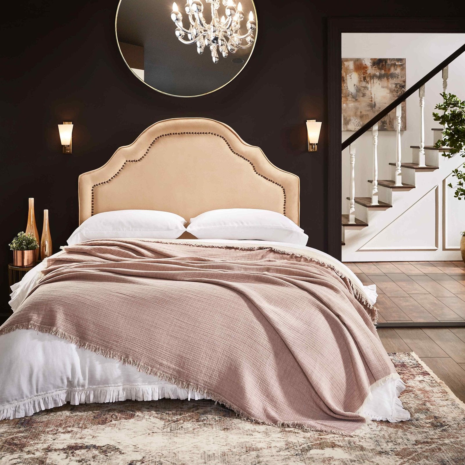 BT-110-9496_4|Blush pink textured cotton blanket with delicate fringe draped over a king bed, enhancing cozy bedroom decor.