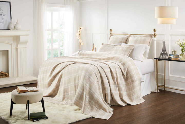 BT-118-9496_5|Soft beige and white plaid patterned cotton quilt blanket draped elegantly over a bed, offering warmth and classic style.