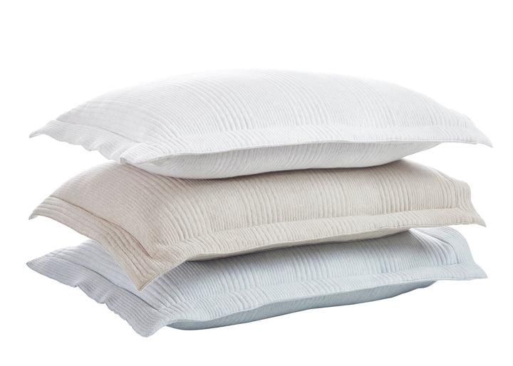 SS-039-X_1|Stacked set of three plush crinkled pillow shams in white, beige, and light blue, offering soft, inviting bedding layers.