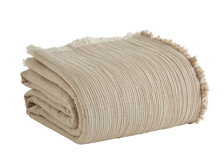 BT-101-11096_4|Folded beige textured blanket with a stylish fringe edge, perfect for cozying up. Soft, natural tone throw for elegant home decor.