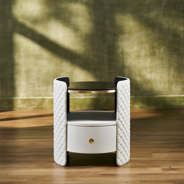 FN-5214-202022_1|White leather nightstand featuring diamond-quilted curved sides, a round black glass top, and one drawer with a gold-toned knob.