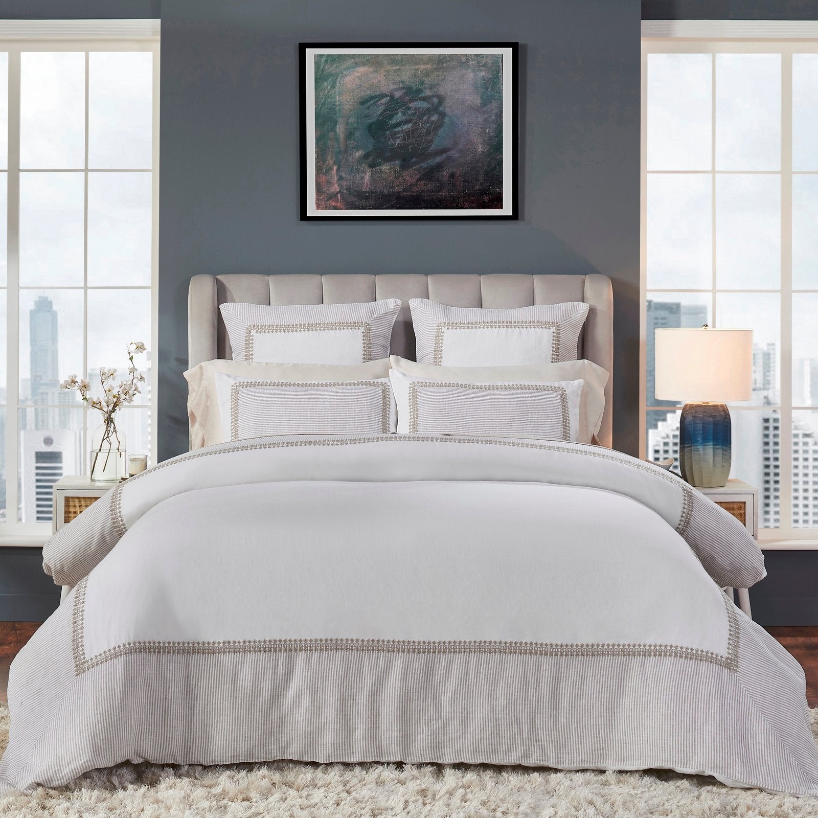 DT-030-X_1|Elegant white bedding ensemble with subtle beige textured decorative pillows, creating a serene and luxurious bedroom setting.