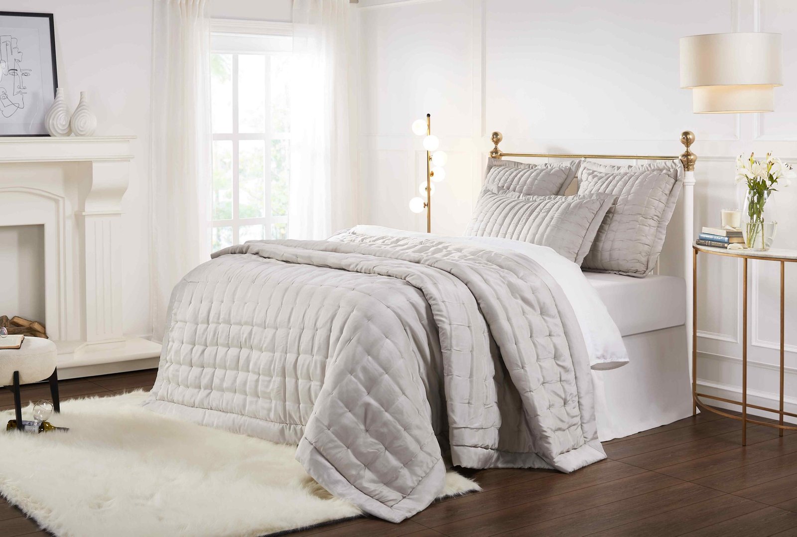 QT-334-9496_4|Luxurious light beige quilted quilt and matching shams adorning a bed in a chic, serene bedroom setting.
