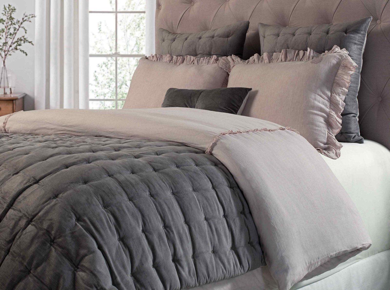 DT-004A-X_2|Cozy bedroom with a luxurious grey quilted bedspread, a pink linen blend ruffled duvet and shams.