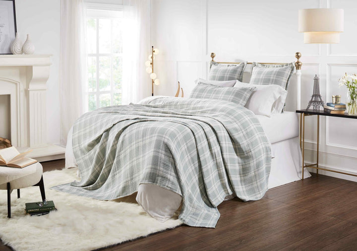 BT-119-11096_5|Stylish bedroom featuring a soft sage green and white plaid blanket draped over a bed, creating a tranquil sleeping space.
