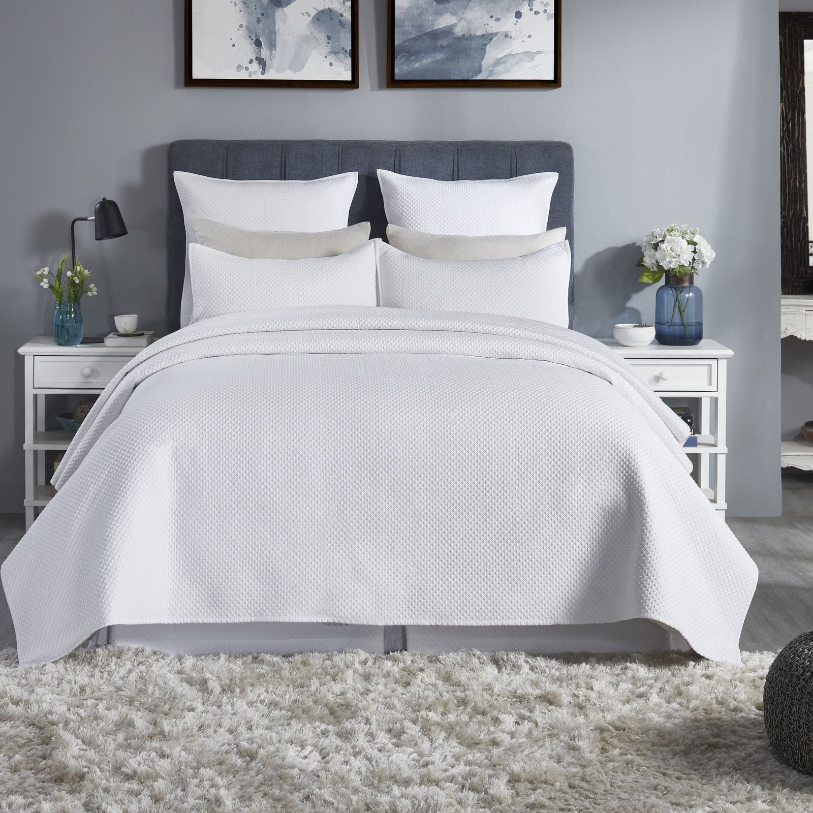 CL-200-9496_1|Crisp white textured coverlet beautifully drapes a queen bed, enhancing a serene, modern bedroom design.