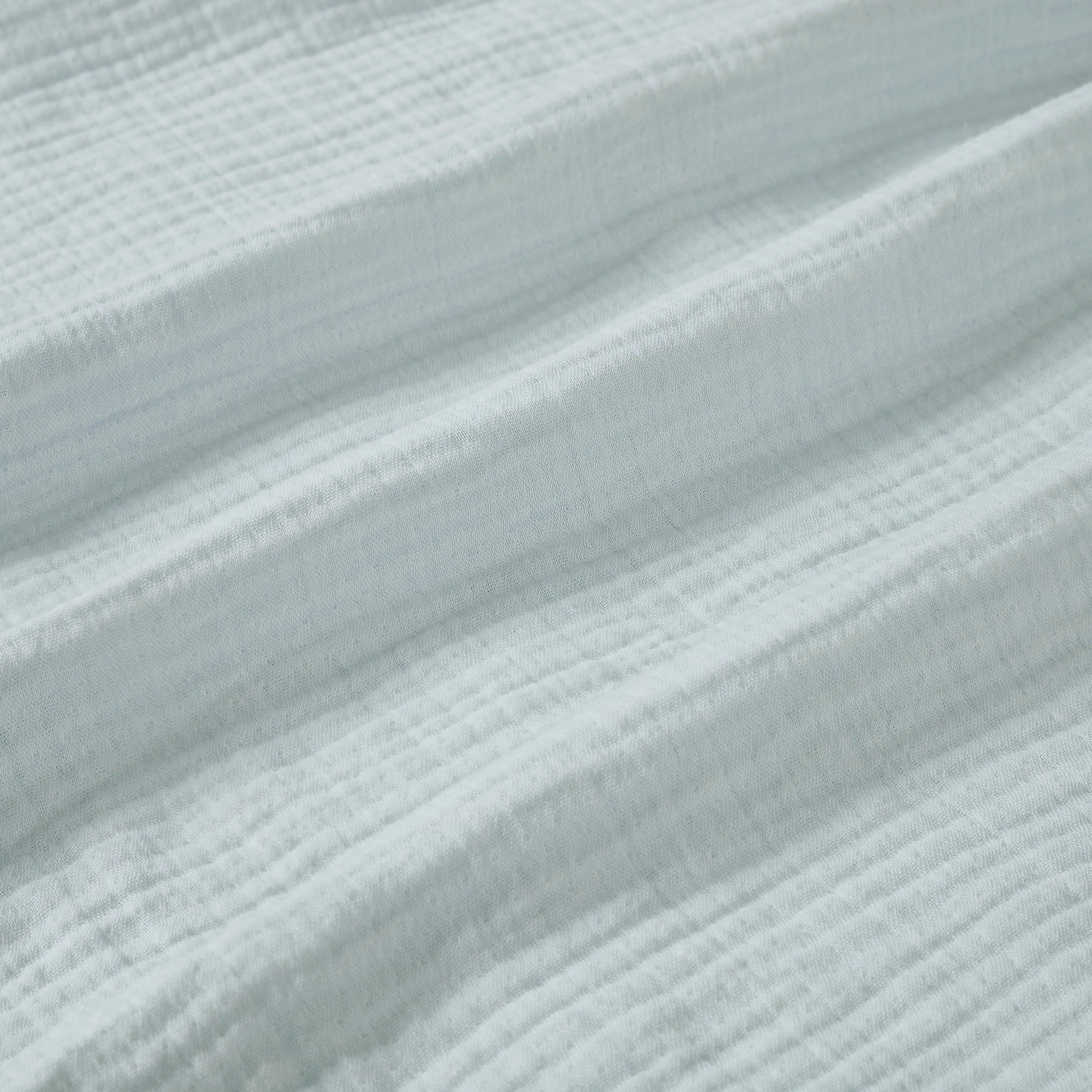 BL-863-9496_9|Close-up of soft light blue gauze blanket texture, breathable cotton weave, perfect for airy bedding and cozy comfort.