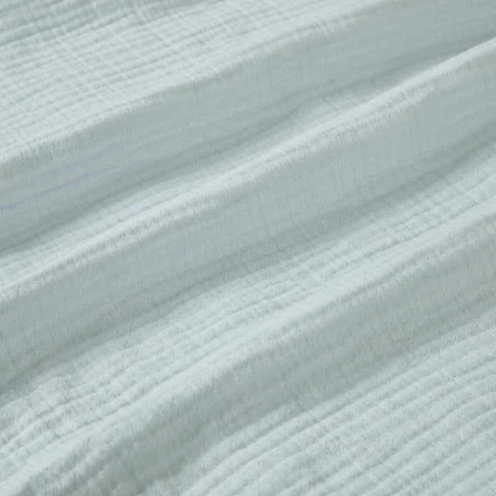 BL-863-9496_9|Close-up of soft light blue gauze blanket texture, breathable cotton weave, perfect for airy bedding and cozy comfort.