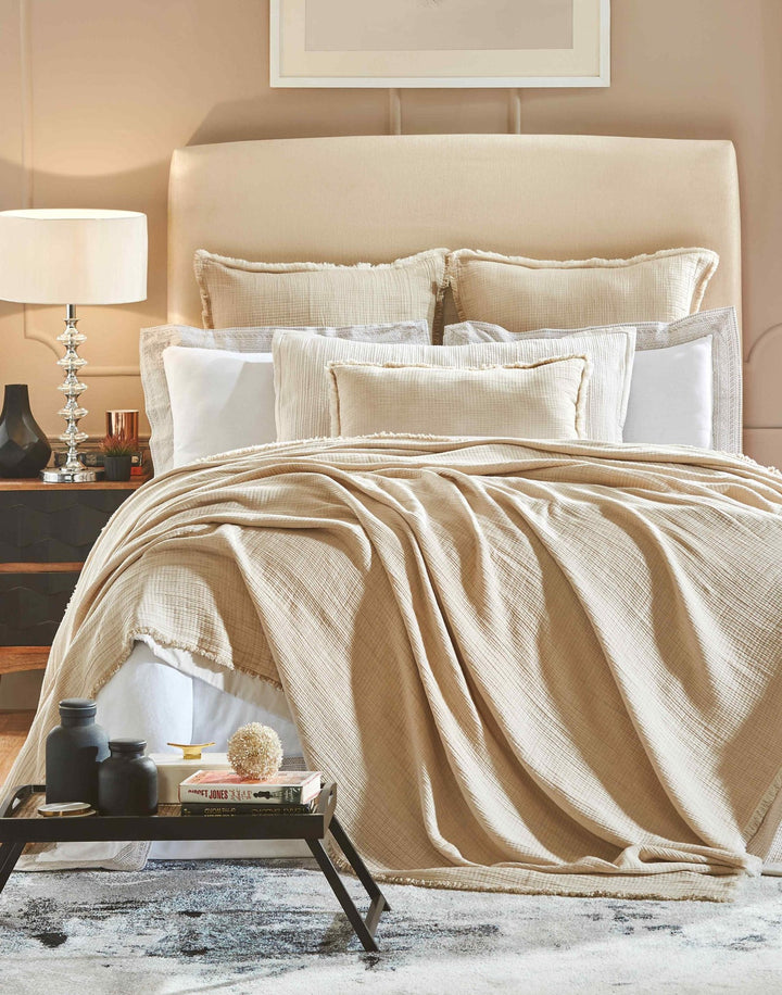 BT-101-9496_1|Luxurious beige textured blanket draped elegantly over a queen bed, enhancing cozy bedroom decor with a neutral palette.