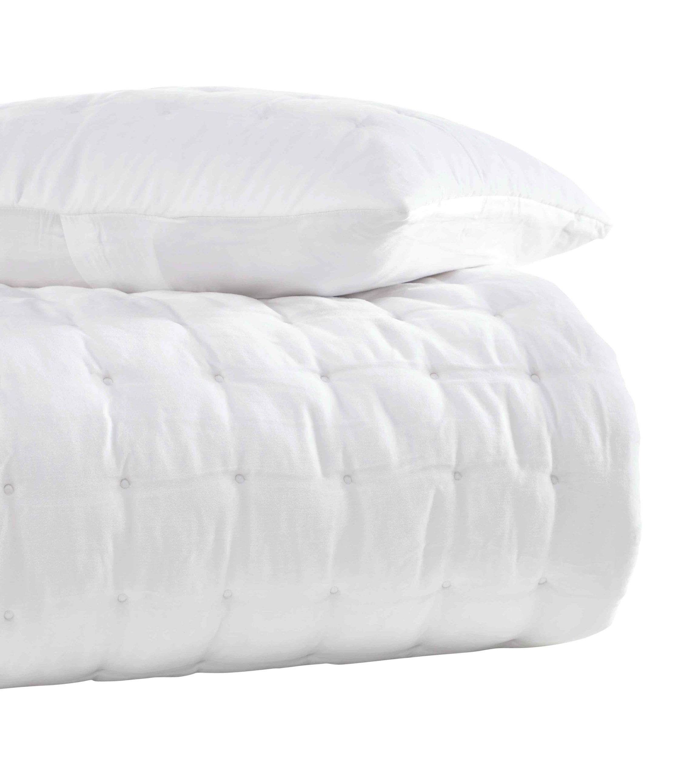QT-353-11096_3|Stack of a white quilted comforter and matching pillow, highlighting plush texture and clean modern design. Soft bedding.