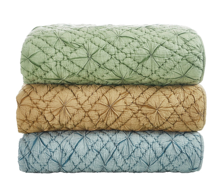 QT-364-X_2|Stacked green, gold, and blue luxurious quilted cotton coverlets with intricate pin-tuck details, perfect for bedding.