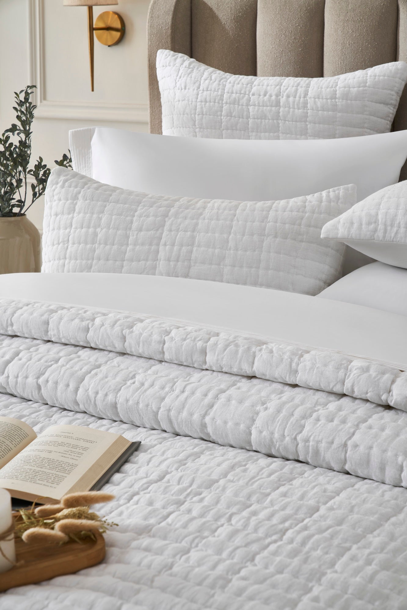 QT-372-11096_4|Inviting white textured quilt and pillows offer ultimate comfort and softness, perfect for a relaxing and cozy bedroom.