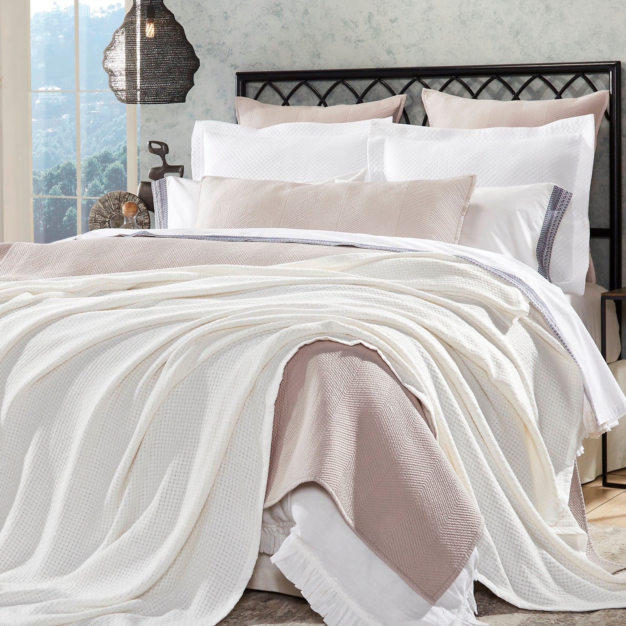 BL-852-9496_1|Draped white waffle weave blanket on a cozy bed with neutral bedding, adding a luxurious texture to bedroom decor.