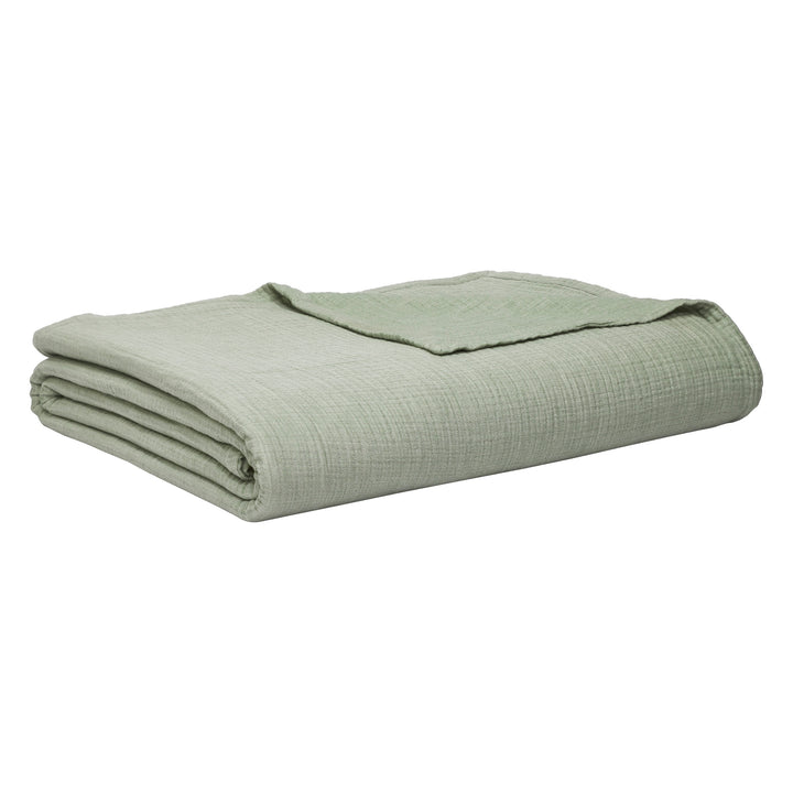BL-864-11096_7|Neatly folded sage green textured blanket with a gentle drape, offering cozy comfort and versatile home styling.