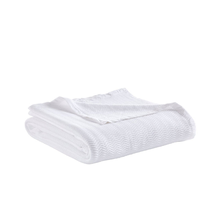 BL-853-X_2|Neatly folded white chevron-patterned blanket, offering a soft texture and modern design, perfect for home comfort.