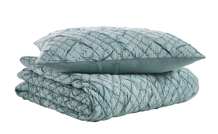QT-365-9496_6|Teal blue quilt and coordinating sham, neatly folded, with a stunning geometric quilted design for modern bedroom elegance.