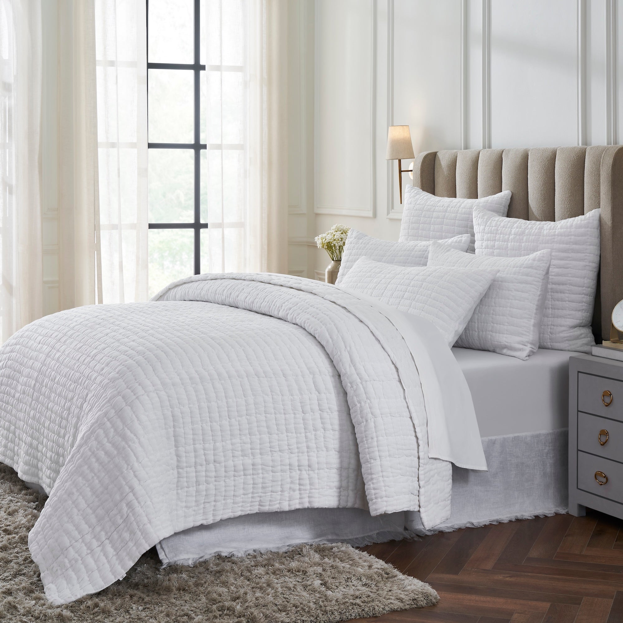 QT-372-11096_2|Cozy white textured quilt set enhancing a bright bedroom, providing soft comfort and an elegant, serene bedding ensemble.